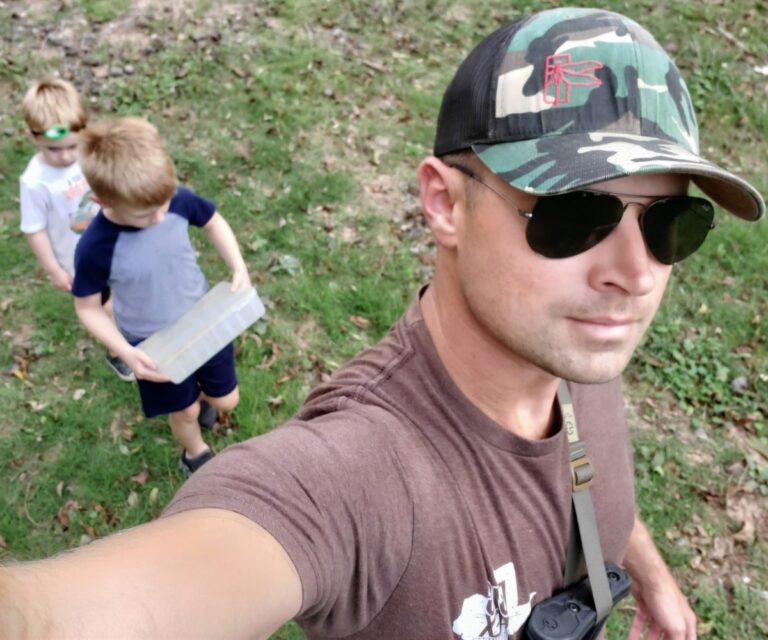 Dan, founder of Dan Designs Things, outdoors with his two boys